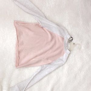 A light pink and white sweater.